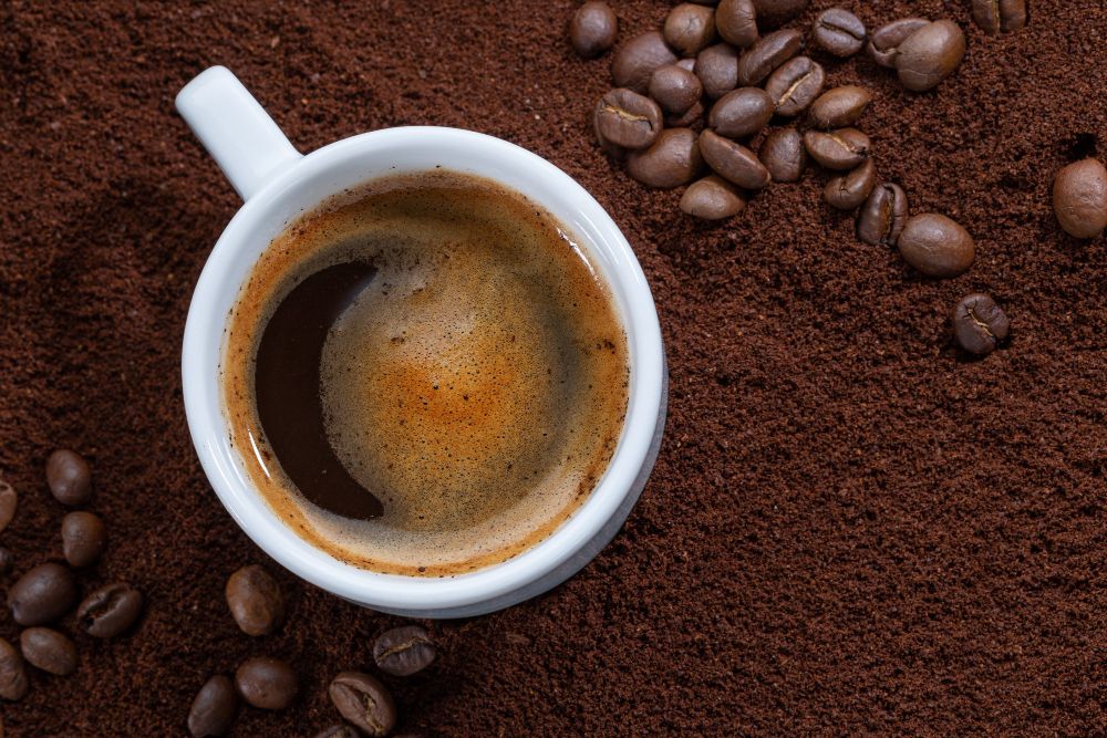 Cup of Coffee on Ground Coffee