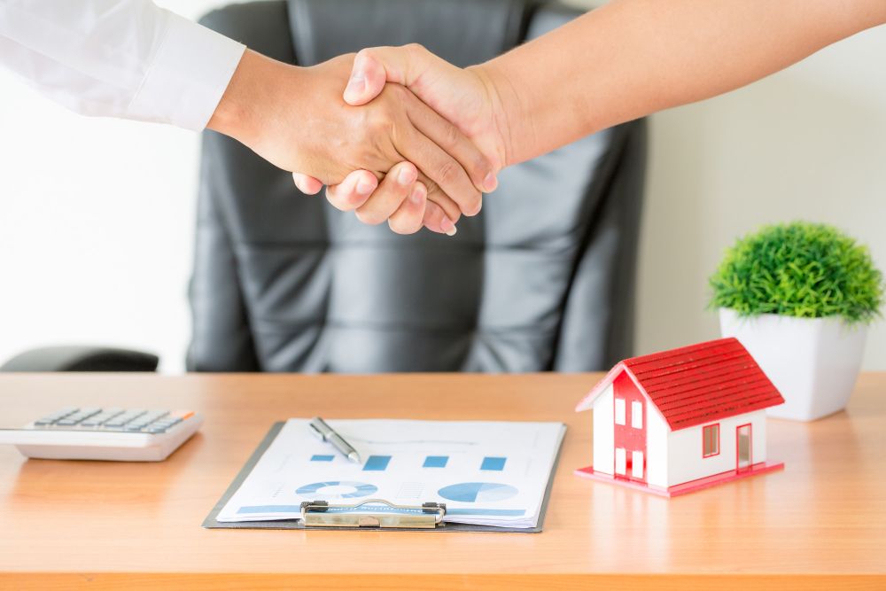 Hands of Agent and Client Shaking Hands After Signed Contract Buy New Apartment
