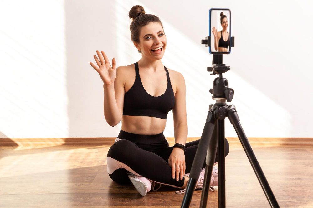 Trainer Saying Hello or Bye, Recording Online Tutorial of Fitness Exercises