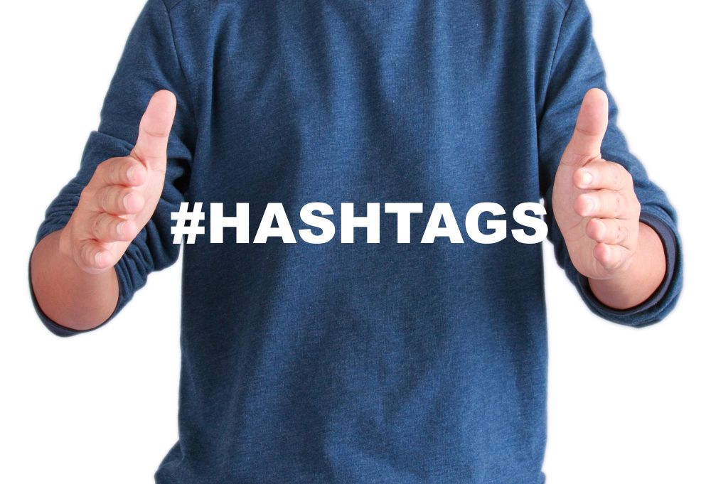 The Hands of Men With Text Hashtags